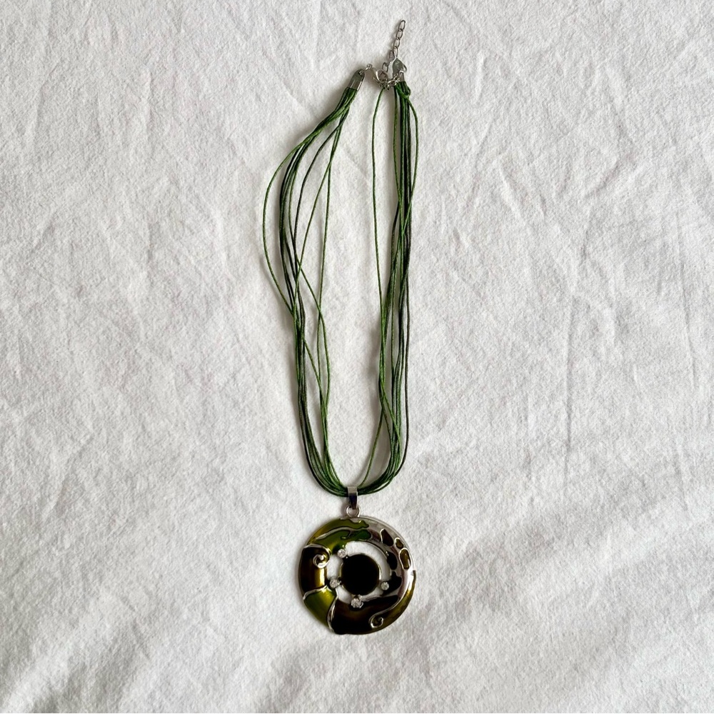 Green cord necklace with circle pendant